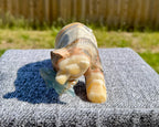 Zebra Calcite Grizzly Bear with Blue Onyx Fish - Banded Calcite Carving