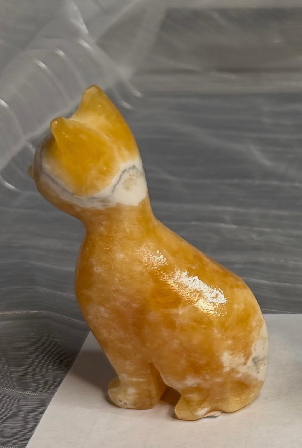 Orange Calcite Cat Carving - UV Reactive Fluorescent Stone Figurine