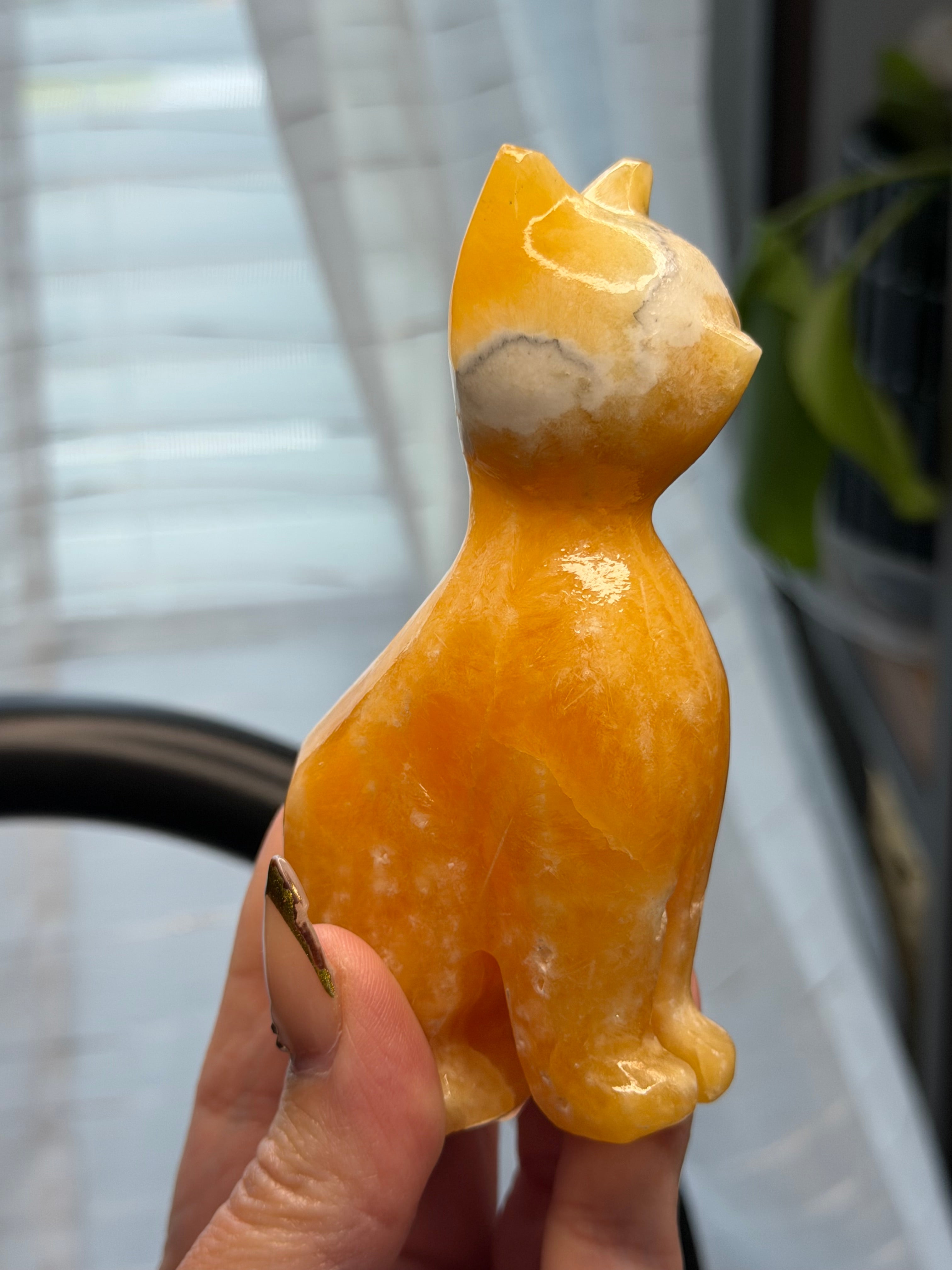 Orange Calcite Cat Carving - UV Reactive Fluorescent Stone Figurine