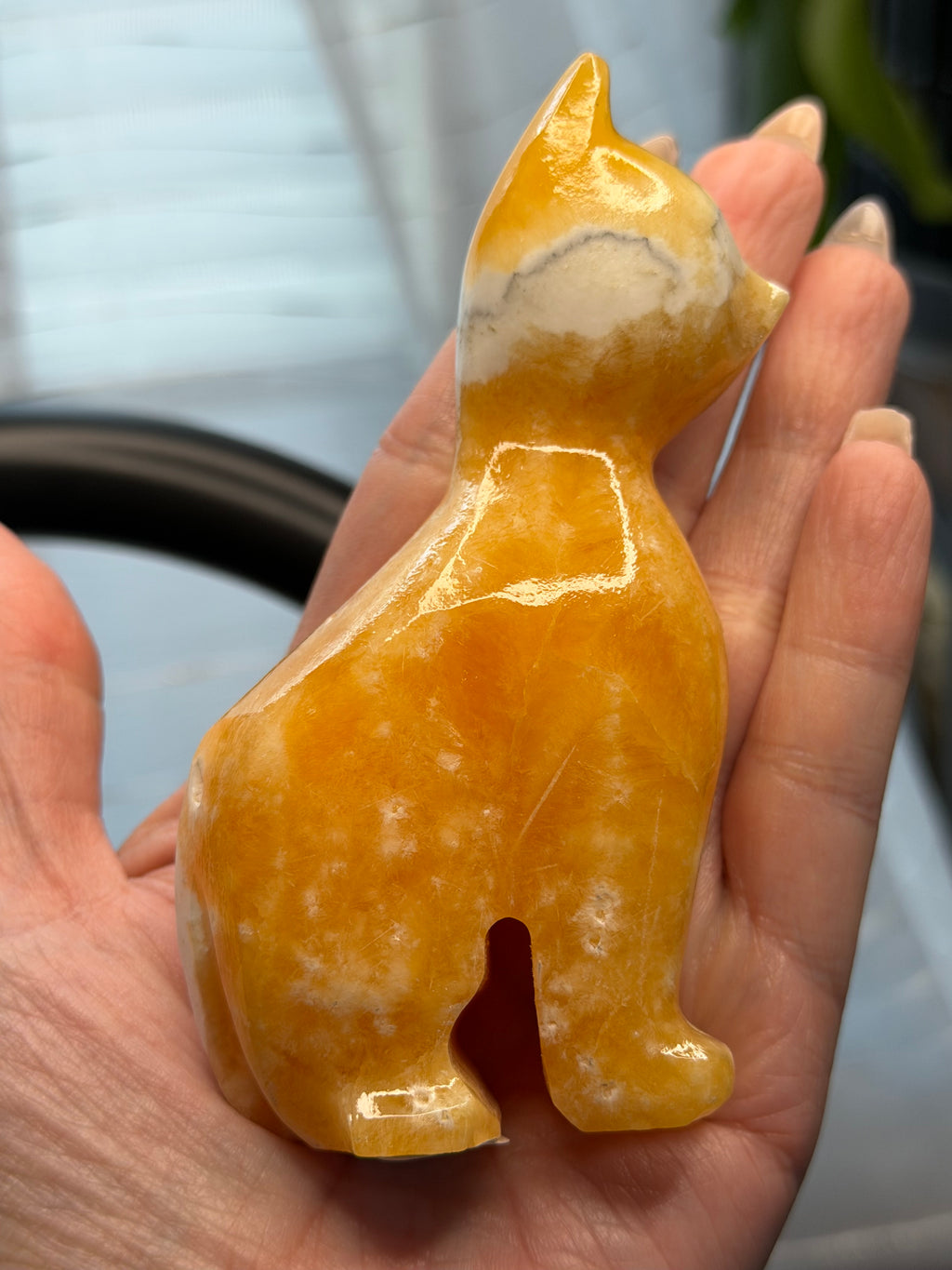Orange Calcite Cat Carving - UV Reactive Fluorescent Stone Figurine