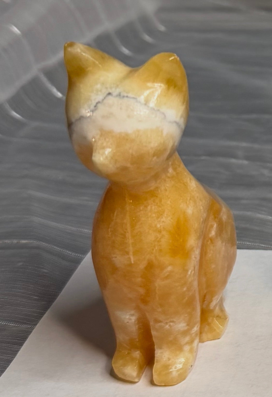 Orange Calcite Cat Carving - UV Reactive Fluorescent Stone Figurine